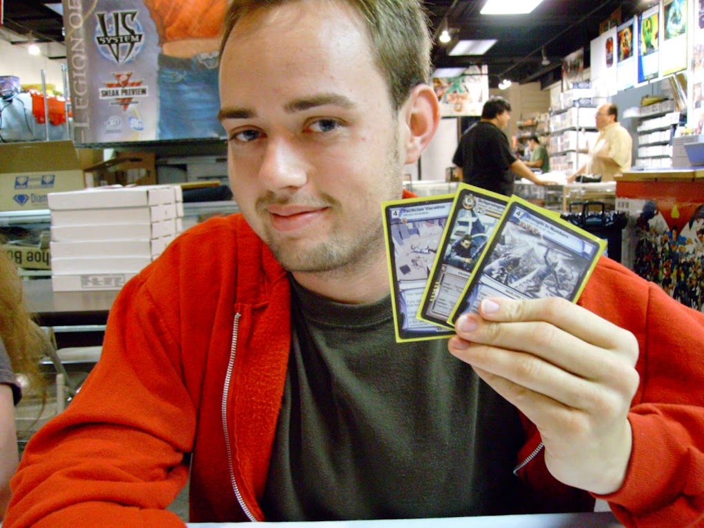 Holding a hand of cards at a card game event in a game shop
